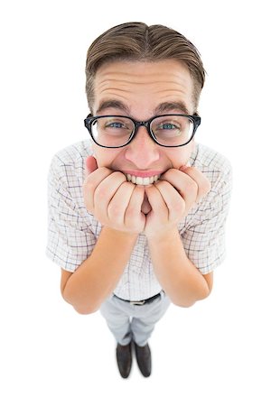 Geeky hipster looking nervously at camera on white background Stock Photo - Budget Royalty-Free & Subscription, Code: 400-07727233