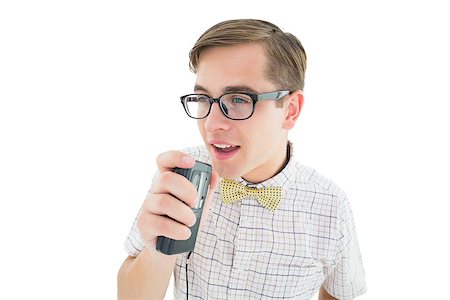 Geeky hipster speaking into dictaphone on white background Stock Photo - Budget Royalty-Free & Subscription, Code: 400-07727255