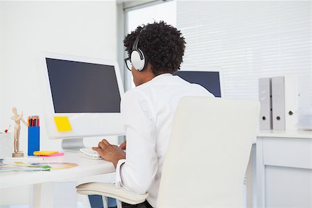 simsearch:400-07926810,k - Hipster designer working at his desk in his office Fotografie stock - Microstock e Abbonamento, Codice: 400-07727468