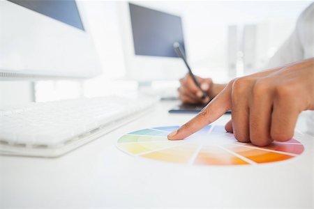 simsearch:400-07466593,k - Designer working at desk using a colour wheel in his office Stock Photo - Budget Royalty-Free & Subscription, Code: 400-07727484