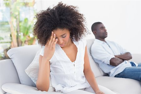 Attractive couple having an argument on couch at home in the living room Stock Photo - Budget Royalty-Free & Subscription, Code: 400-07727671