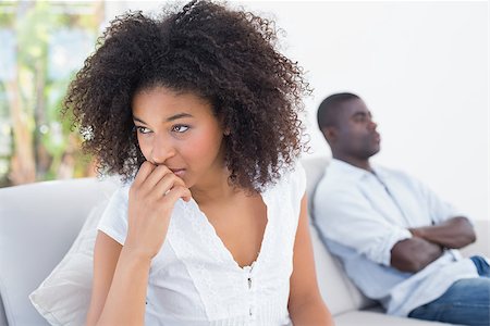 Attractive couple not talking on the couch at home in the living room Stock Photo - Budget Royalty-Free & Subscription, Code: 400-07727672