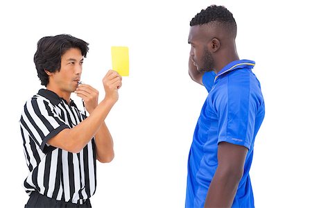 simsearch:622-08007327,k - Referee showing yellow card to football player on white background Photographie de stock - Aubaine LD & Abonnement, Code: 400-07727989