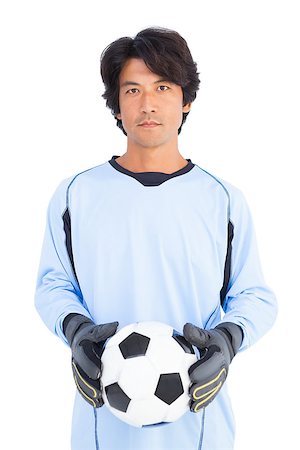 simsearch:622-08123209,k - Goalkeeper in blue holding ball on white background Stock Photo - Budget Royalty-Free & Subscription, Code: 400-07728026