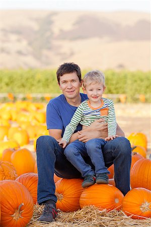 simsearch:400-07916492,k - happy young father and his cute son spending fun time together at pumpkin patch; family of two at fall Stock Photo - Budget Royalty-Free & Subscription, Code: 400-07728451