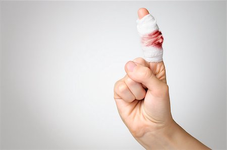 simsearch:400-07669067,k - Injured finger with bloody gauze bandage Fotografie stock - Microstock e Abbonamento, Codice: 400-07728915