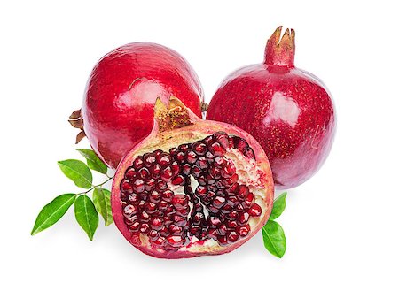 simsearch:400-06457388,k - Juicy pomegranate fruit with leaves isolated on a white background Photographie de stock - Aubaine LD & Abonnement, Code: 400-07728912