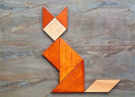 simsearch:400-07774007,k - abstract picture of a cat built from seven tangram wooden pieces against slate rock background, a traditional Chinese puzzle game, the artwork copyright by the photographer Foto de stock - Royalty-Free Super Valor e Assinatura, Número: 400-07729132