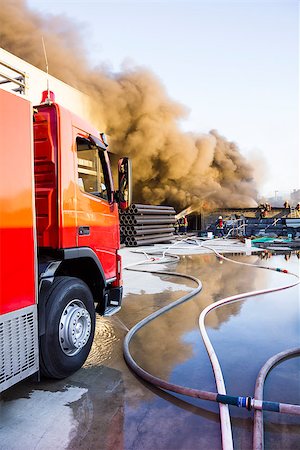 damaged roof - fire engine with the plant fire background Stock Photo - Budget Royalty-Free & Subscription, Code: 400-07720105