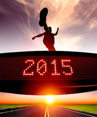 happy new year 2015.runner jumping and crossing over matrix display for celebrating 2015 Stock Photo - Budget Royalty-Free & Subscription, Code: 400-07720100