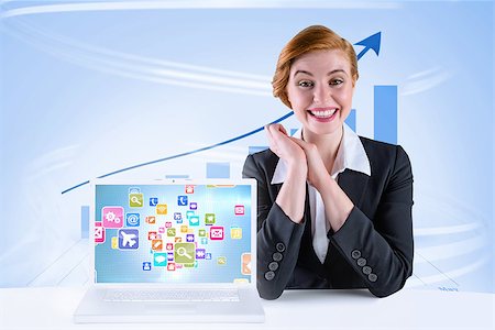 Excited redhead businesswoman sitting at desk against blue bar chart with blue arrow Stock Photo - Budget Royalty-Free & Subscription, Code: 400-07720700