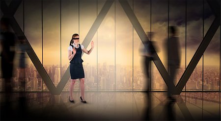 Redhead businesswoman in a blindfold against room with large window looking on city Stock Photo - Budget Royalty-Free & Subscription, Code: 400-07720785