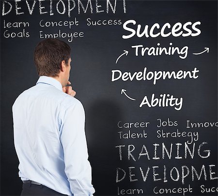 simsearch:6109-07601648,k - Thinking businessman touching his chin against blackboard with business buzzwords Stock Photo - Budget Royalty-Free & Subscription, Code: 400-07720823