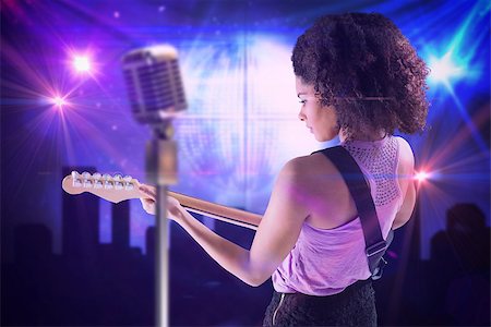 simsearch:400-07720894,k - Pretty girl playing guitar against digitally generated disco ball background Foto de stock - Super Valor sin royalties y Suscripción, Código: 400-07720947