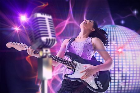 simsearch:400-07720894,k - Pretty girl playing guitar against digitally generated shiny disco ball Foto de stock - Super Valor sin royalties y Suscripción, Código: 400-07720943