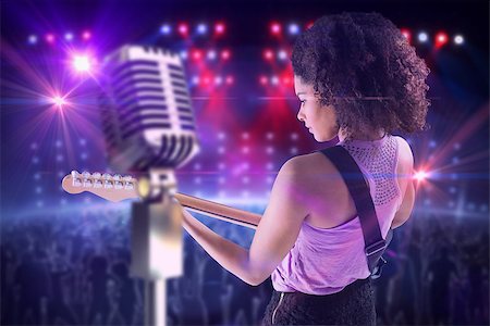 simsearch:400-07720894,k - Pretty girl playing guitar against digitally generated nightclub under lights Foto de stock - Super Valor sin royalties y Suscripción, Código: 400-07720952