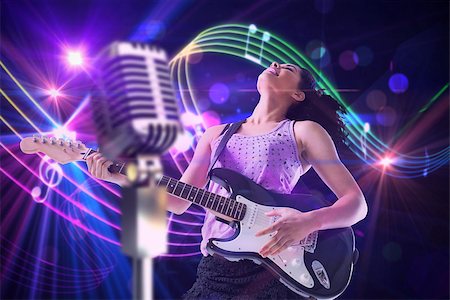 Pretty girl playing guitar against digitally generated music symbol design Stock Photo - Budget Royalty-Free & Subscription, Code: 400-07720953