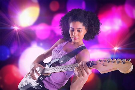 simsearch:400-07477109,k - Pretty girl playing guitar against digitally generated cool nightlife design Stockbilder - Microstock & Abonnement, Bildnummer: 400-07720965