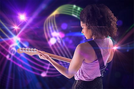 simsearch:400-07720894,k - Pretty girl playing guitar against digitally generated music symbol design Foto de stock - Super Valor sin royalties y Suscripción, Código: 400-07720969