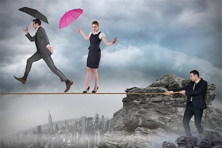 Young businessman pulling a tightrope for business people against rocky landscape Stock Photo - Budget Royalty-Free & Subscription, Code: 400-07721219