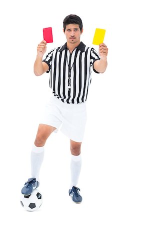 simsearch:622-08007327,k - Serious referee showing red and yellow card on white background Photographie de stock - Aubaine LD & Abonnement, Code: 400-07721658