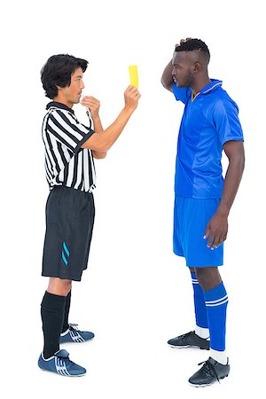 simsearch:622-08007327,k - Referee showing yellow card to football player on white background Photographie de stock - Aubaine LD & Abonnement, Code: 400-07721741