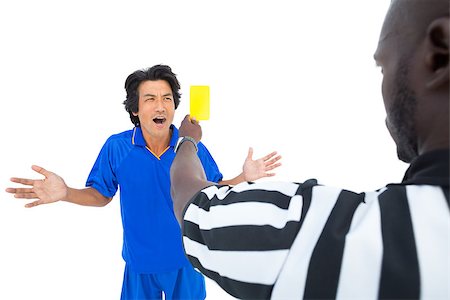 simsearch:622-08007327,k - Serious referee showing yellow card to player on white background Photographie de stock - Aubaine LD & Abonnement, Code: 400-07721754