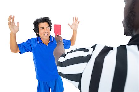 simsearch:622-08007327,k - Serious referee showing red ard to player on white background Photographie de stock - Aubaine LD & Abonnement, Code: 400-07721756