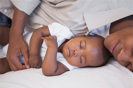 simsearch:614-03576718,k - Father napping with baby son on couch at home in the living room Photographie de stock - Aubaine LD & Abonnement, Code: 400-07722286
