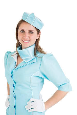 simsearch:400-07752842,k - Portrait of a beautiful stewardess dressed in blue uniform over white background Stock Photo - Budget Royalty-Free & Subscription, Code: 400-07722699