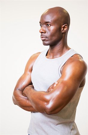 simsearch:400-05082999,k - Serious muscular man with arms crossed looking away over white background Stock Photo - Budget Royalty-Free & Subscription, Code: 400-07723061