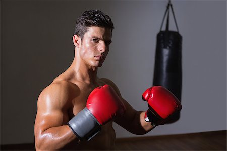 simsearch:400-06876600,k - Portrait of a serious muscular boxer in health club Stock Photo - Budget Royalty-Free & Subscription, Code: 400-07723264