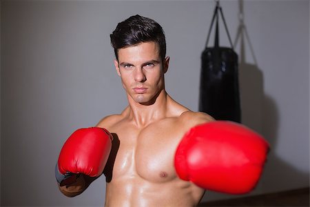 simsearch:400-06876600,k - Portrait of a serious muscular boxer in health club Stock Photo - Budget Royalty-Free & Subscription, Code: 400-07723263