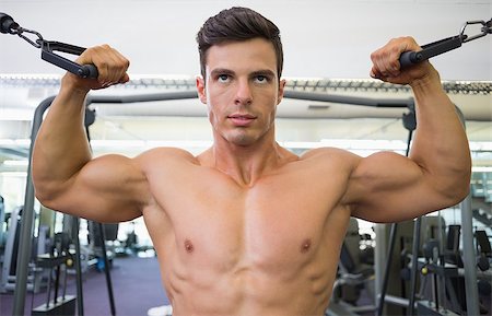 resistance band and men - Portrait of a shirtless young muscular man using resistance band in gym Stock Photo - Budget Royalty-Free & Subscription, Code: 400-07723405