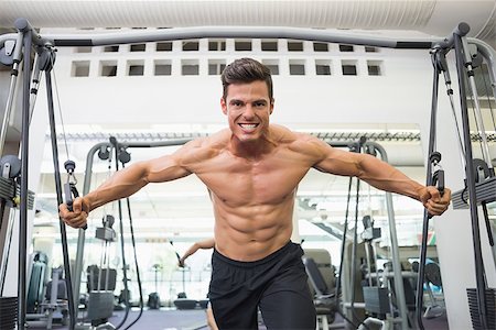 resistance band and men - Portrait of a shirtless young muscular man using resistance band in gym Stock Photo - Budget Royalty-Free & Subscription, Code: 400-07723402