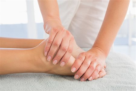 simsearch:400-07723724,k - Close-up of a young woman receiving leg massage at spa center Photographie de stock - Aubaine LD & Abonnement, Code: 400-07723869