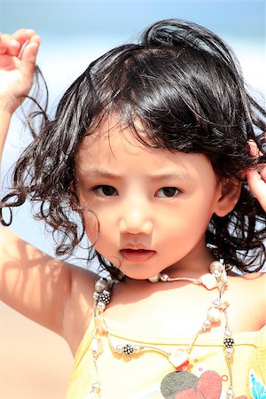 simsearch:400-06098679,k - Portrait of the beautiful small Asian girl. Indonesia Fotografie stock - Microstock e Abbonamento, Codice: 400-07745677