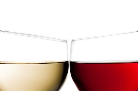 purple drink pouring - cheers, closeup of two glasses of red wine and white wine against white background Stock Photo - Budget Royalty-Free & Subscription, Code: 400-07745774