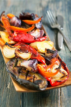 Roasted peppers, onions, eggplant, potatoes and carrots on a wooden table. Stock Photo - Budget Royalty-Free & Subscription, Code: 400-07745817