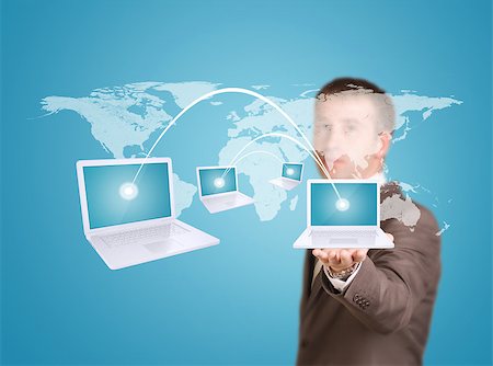 future earth icon - Businessman in a suit hold virtual world map with laptops. Internet concept Stock Photo - Budget Royalty-Free & Subscription, Code: 400-07746292