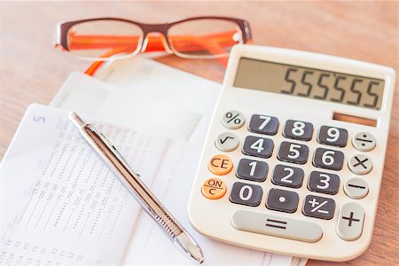 eye glasses images investing - Work station with calculator, pen and eyeglasses, stock photo Stock Photo - Budget Royalty-Free & Subscription, Code: 400-07746435