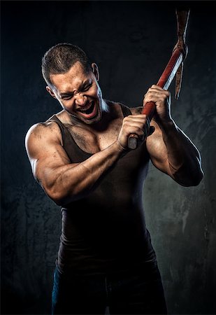 power ax - Muscular man holding pickaxe Photographie de stock - Aubaine LD & Abonnement, Code: 400-07747016