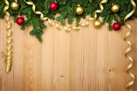 Christmas background with fresh firtree, baubles and ribbons on wood - horizontal Stock Photo - Budget Royalty-Free & Subscription, Code: 400-07747727