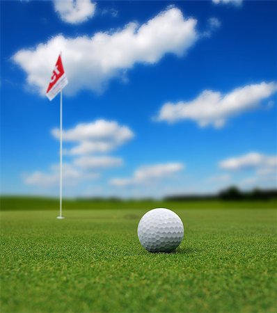 simsearch:400-03975619,k - Golf ball in front of a flag on the green Stock Photo - Budget Royalty-Free & Subscription, Code: 400-07748513