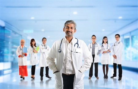 Multiracial diversity Asian medical team, expertise senior and mature doctors leading young practitioners, standing inside hospital. Stock Photo - Budget Royalty-Free & Subscription, Code: 400-07748781