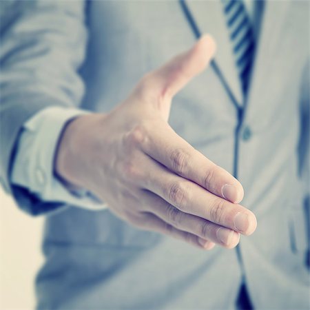 effect - Close up businessman offer hand shake, in vintage retro toned effect. Stock Photo - Budget Royalty-Free & Subscription, Code: 400-07748791