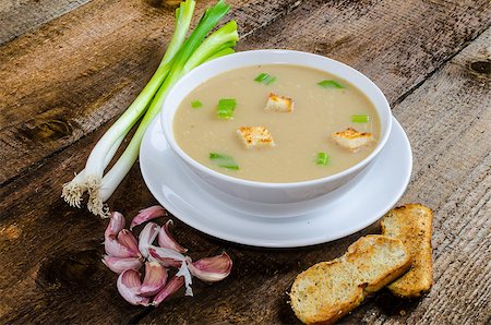 french bean dish - Soup garlic with toasted croutons on wood table Stock Photo - Budget Royalty-Free & Subscription, Code: 400-07748893