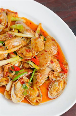 Stir fried clams with roasted chili paste and thai basil leaves Stock Photo - Budget Royalty-Free & Subscription, Code: 400-07749282