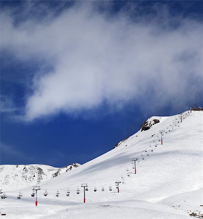 simsearch:400-04340231,k - Chair-lift and ski slope in sun day. Caucasus Mountains, Georgia. Ski resort, Gudauri. Stock Photo - Budget Royalty-Free & Subscription, Code: 400-07749728