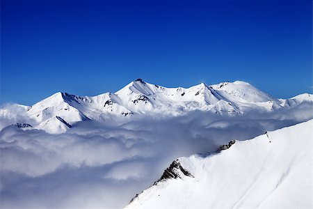 simsearch:400-08530488,k - Mountains in clouds at nice day. Caucasus Mountains, Georgia, Gudauri. View from ski slope. Stock Photo - Budget Royalty-Free & Subscription, Code: 400-07749733